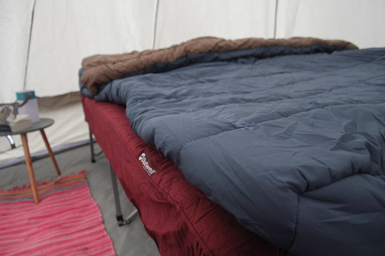 The Outwell Centuple Double Foldaway Camp Bed with padded top cover