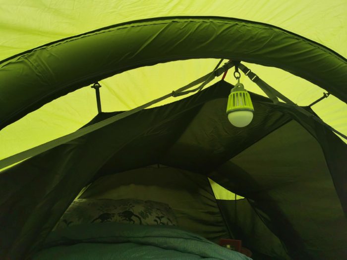 The gaps between velcro closures across the bottom of the tent door