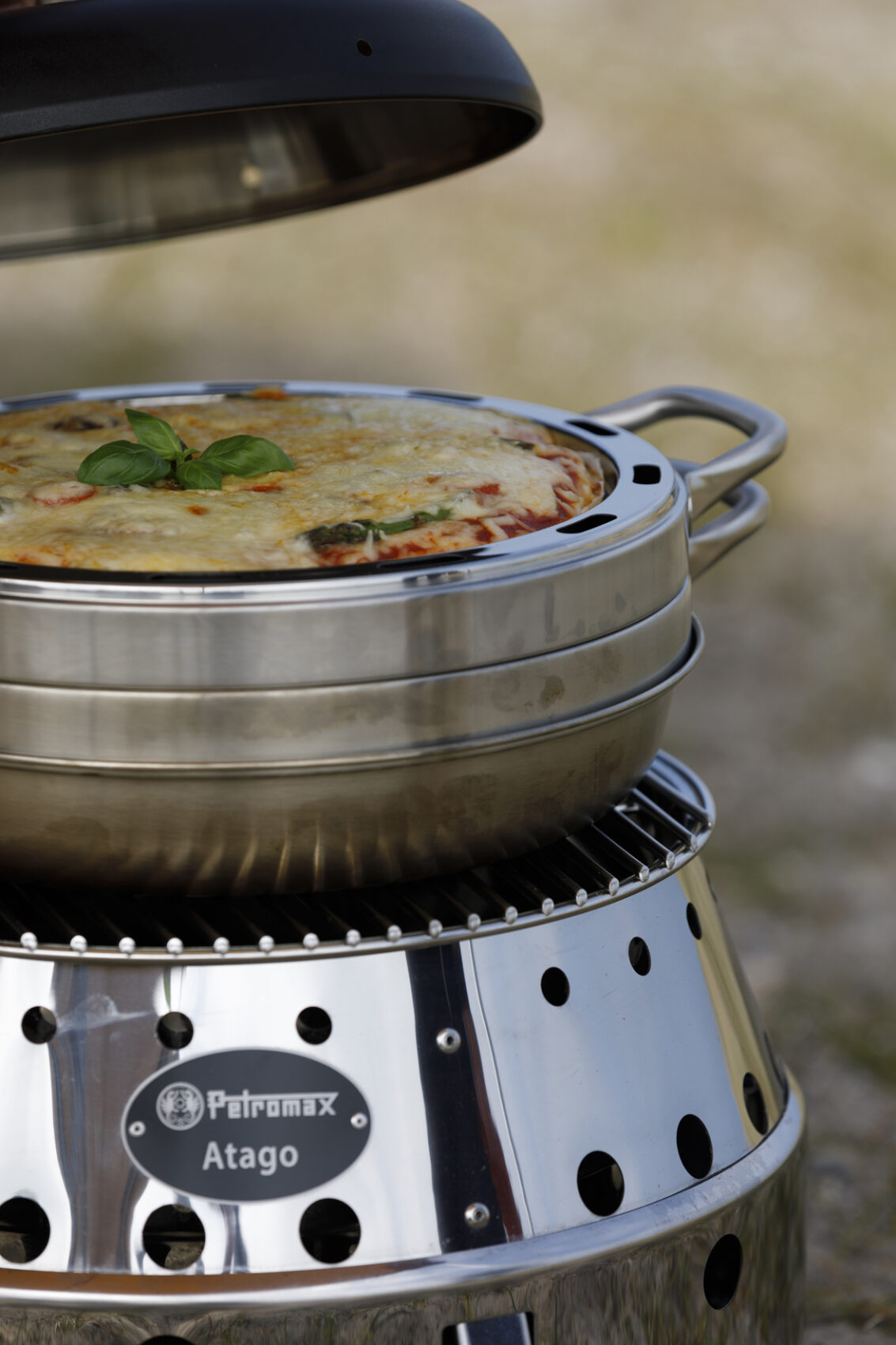 https://www.campingwithstyle.co.uk/wp-content/uploads/2023/04/Petromax-Baking-Tray-and-Camping-Oven-on-Atago-Stove-scaled.jpg